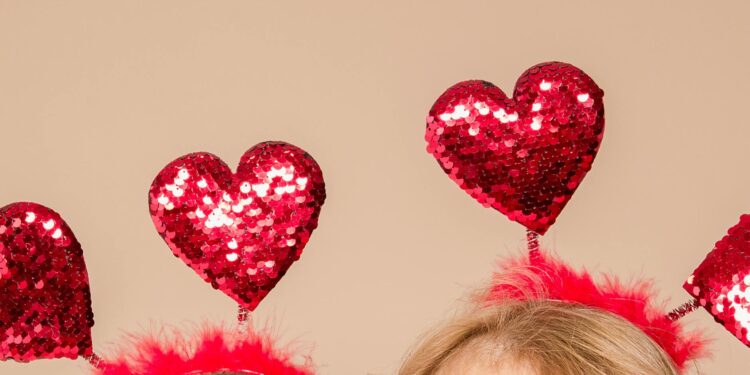 Cute Pudgy Penguins dressed in Valentine-themed accessories at a NYC pop-up event.
