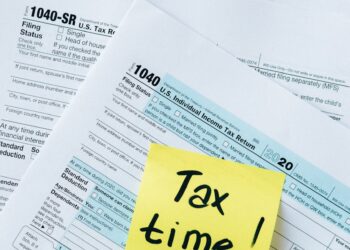 A group of lawmakers discussing cryptocurrency tax regulations in Indiana.