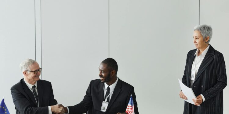 MARA Holdings and Starwood executives shake hands at a signing ceremony for AI data centers.