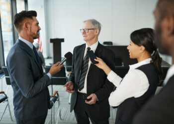 SBI and Startale executives discuss the launch of JPYSC stablecoin at a press conference.