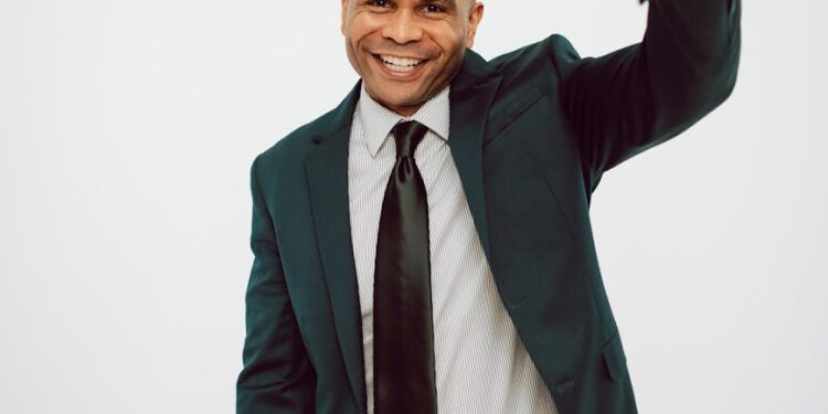 Crypto.com CEO on stage unveiling AI.com for decentralized agents at Super Bowl event.