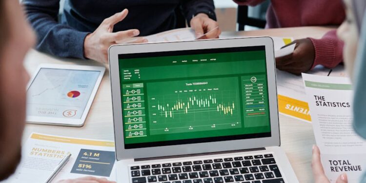 Business meeting with finance professionals discussing workforce reductions and company strategies.