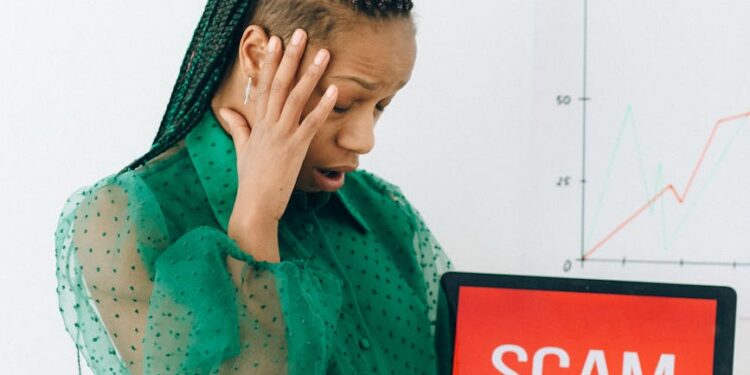 A person holding a smartphone with Revolut’s logo, concerned about data security.