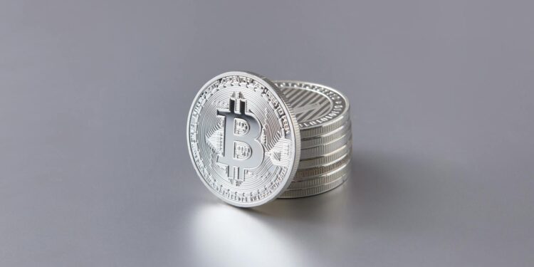 Bitcoin coins stacked with a rising graph overlay, symbolizing financial growth and ETF inflows.