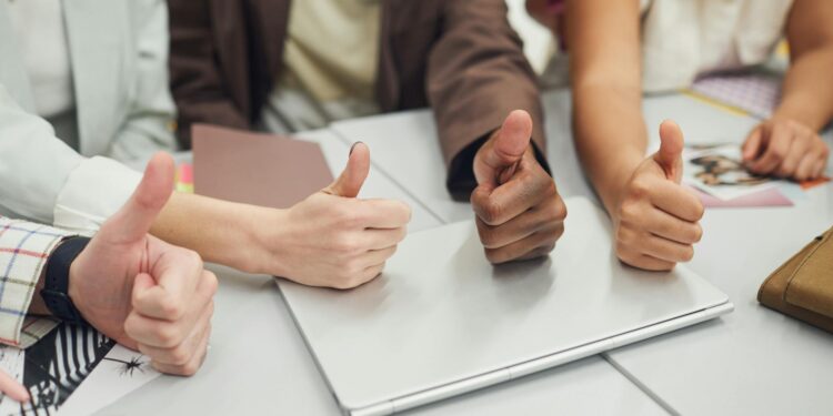 Stripe's Bridge team celebrates OCC approval for their bank charter in a modern office setting.