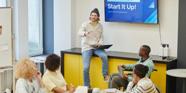A diverse group of professionals discusses the new Forex remittance platform launch.