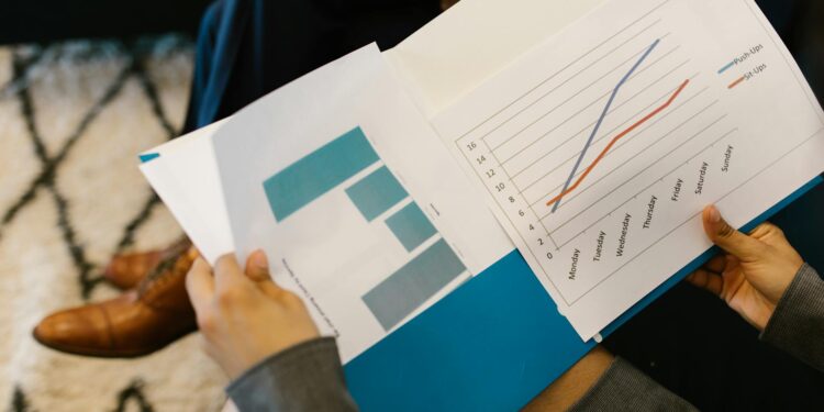 MARA Holdings executive discusses AI strategy at a corporate meeting with finance charts.