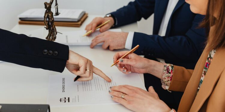Gold Trump statue with dollar signs in a crypto-themed context, highlighting legal disputes.