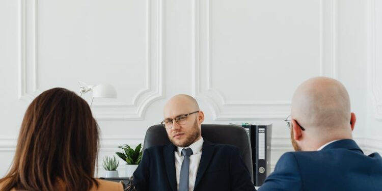 Binance CEO discussing legal options against sanctions related to Iran in a boardroom setting.