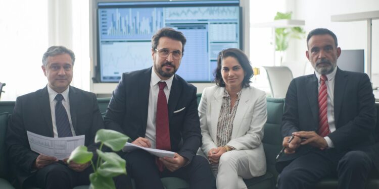 Business meeting with finance professionals discussing regulatory issues and insider trading.