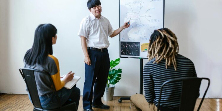 Group of diverse people discussing Ethereum staking and cryptocurrency strategy.