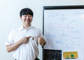 A person trading stocks on a digital platform with cryptocurrency icons in the background.