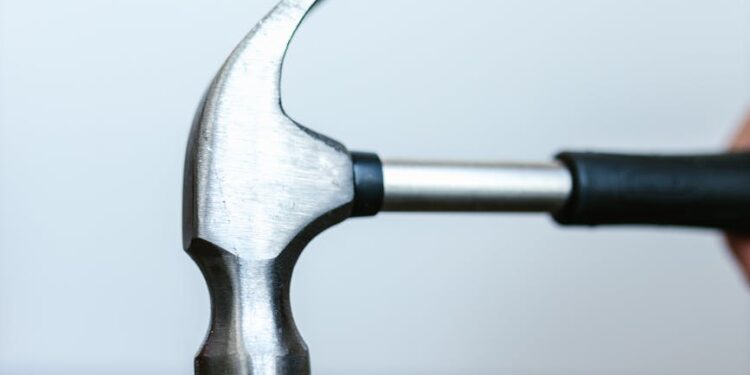 Cryptocurrency symbols with a broken lock, highlighting phishing attack impact on finance.