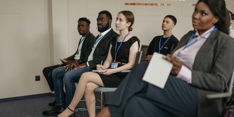 Attendees engage in discussions about AI-powered stablecoin adoption at a Tokyo event.