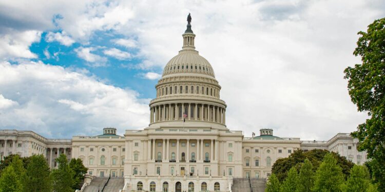 US Senator questioning Binance executives in a congressional hearing on sanctions compliance.
