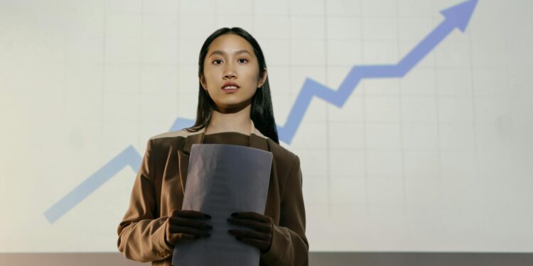 Christopher Delgado speaking at a financial conference, with crypto charts projected behind him.