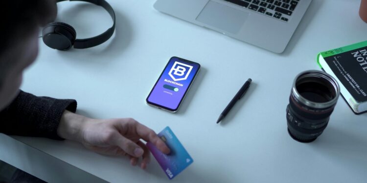 A person using a smartphone app to transfer cryptocurrency to a bank account.