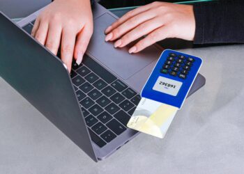 Bitcoin symbol overlaying a payment terminal with the Square logo, highlighting crypto transactions.