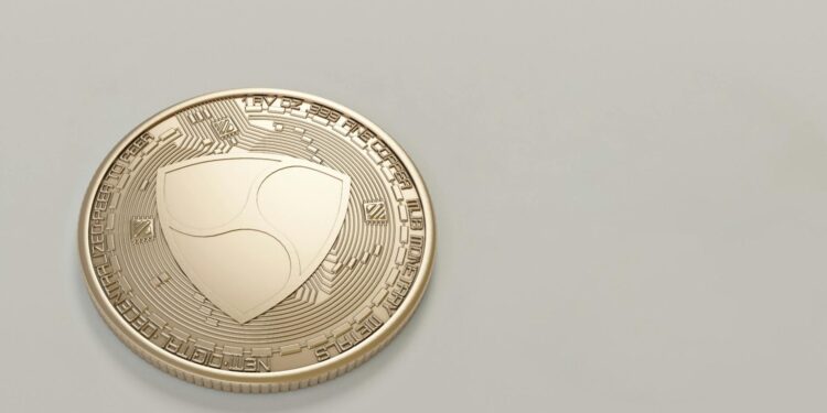 A digital illustration of cryptocurrency coins with a shadowy network diagram in the background.