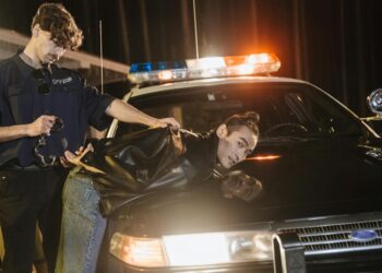 Law enforcement officials discuss actions against a crypto phishing network in an office setting.