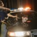 Law enforcement officials discuss actions against a crypto phishing network in an office setting.