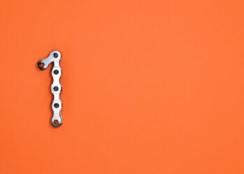 A digital illustration of a chain link breaking, symbolizing crypto laundering and regulations.