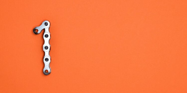 A digital illustration of a chain link breaking, symbolizing crypto laundering and regulations.