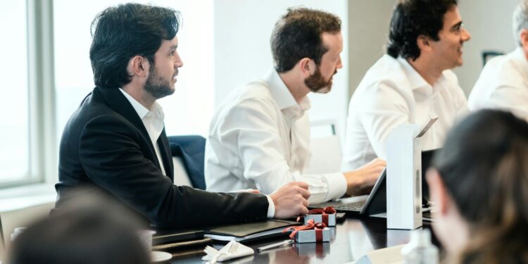 A concerned team discussing AI ethics and content guidelines in a modern office setting.