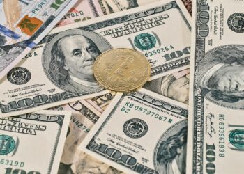 Senators discussing housing bill with digital currency regulations in the background.