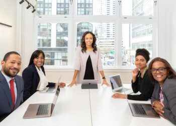 Vancouver city council members discussing cryptocurrency regulations in a meeting room.