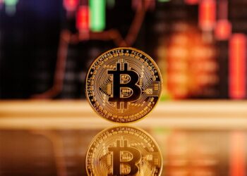 Bitcoin graphic with a downward trend line, contrasting with rising charts for DeFi and NFTs.