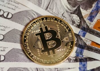 A Bitcoin logo surrounded by rising graphs and dollar signs, symbolizing financial growth.