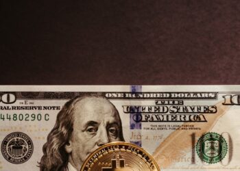 U.S. government officials oversee the first Bitcoin transfer in 2026 at a financial location.