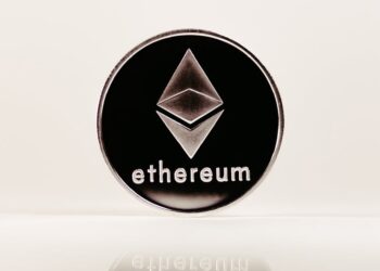 Ethereum logo with a digital chart and dollar signs, reflecting crypto trading and finance.