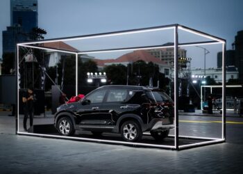 Ripple representatives at a launch event, showcasing their new crypto platform features.