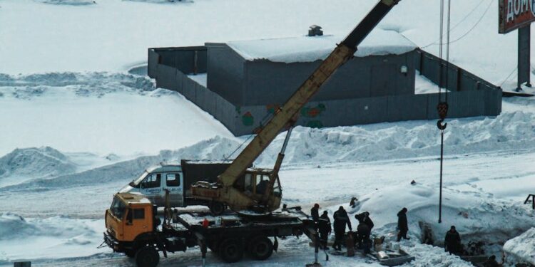 Construction site of a new AI data center in Texas, featuring cranes and workers.