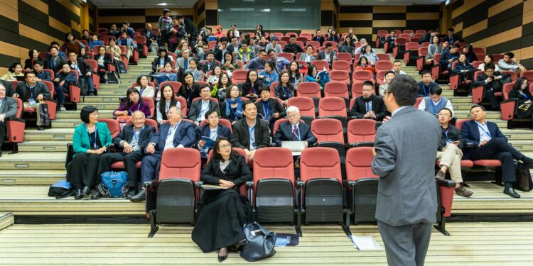 Ripple executives discussing the $50 billion share buyback program at a corporate event.