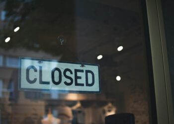 A closed storefront with a "Temporarily Closed" sign, reflecting Kalshi's halted operations.
