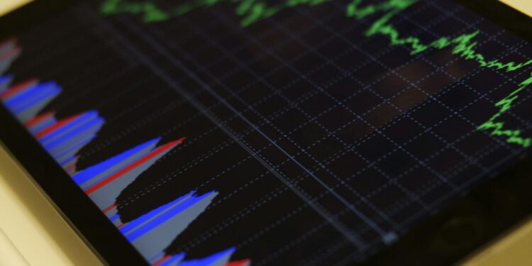Oil barrels stacked with a fluctuating stock market graph in the background.