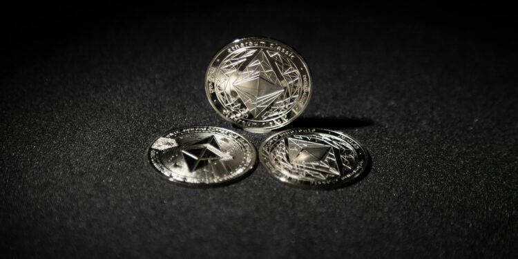 Ethereum coins stacked with a graph showing rising investment interest in cryptocurrencies.