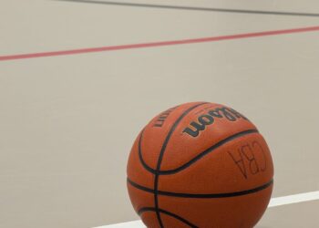 Tristan Thompson leaving a basketball court, fans reacting with mixed emotions.