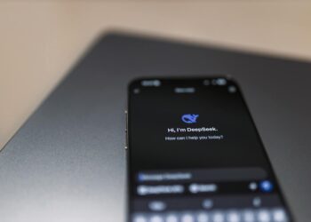 A group of diverse users discussing privacy concerns over a smartphone displaying an AI assistant.