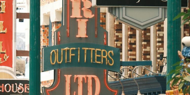 Steven Spielberg speaking at a podium, expressing concerns about AI in film production.