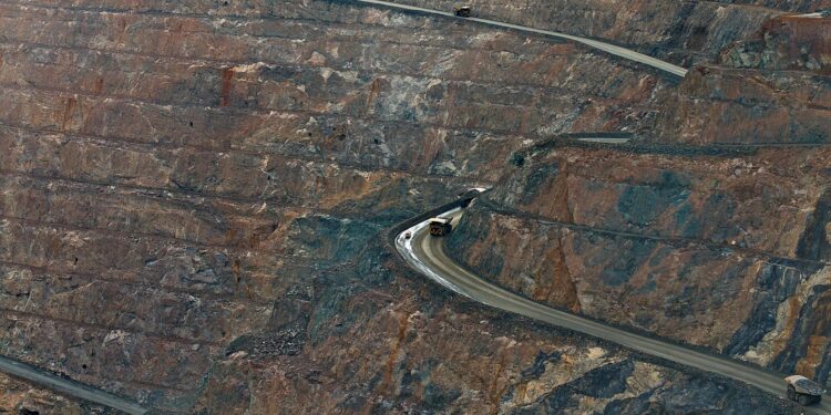 Aerial view of a large data center filled with rows of ASIC miners for Bitcoin mining.