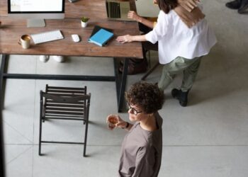 Aave DAO members discussing the V4 mainnet launch in a digital meeting setup.