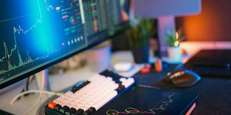 Aave logo displayed on a digital screen with crypto charts, symbolizing DeFi lending.