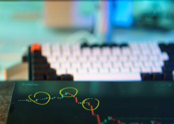 A person analyzing cryptocurrency data on a digital screen with financial charts.