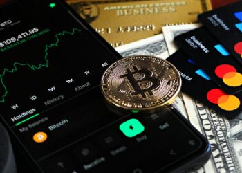 A credit card featuring cryptocurrency symbols and the Avalanche logo, symbolizing innovation in finance.