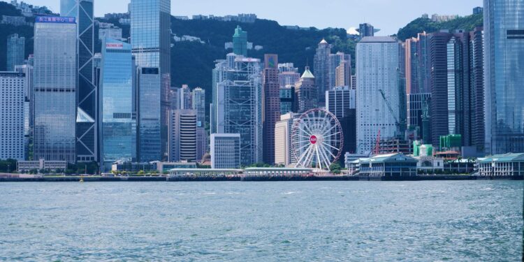 Financial officials in a meeting discussing stablecoin regulations in Hong Kong.