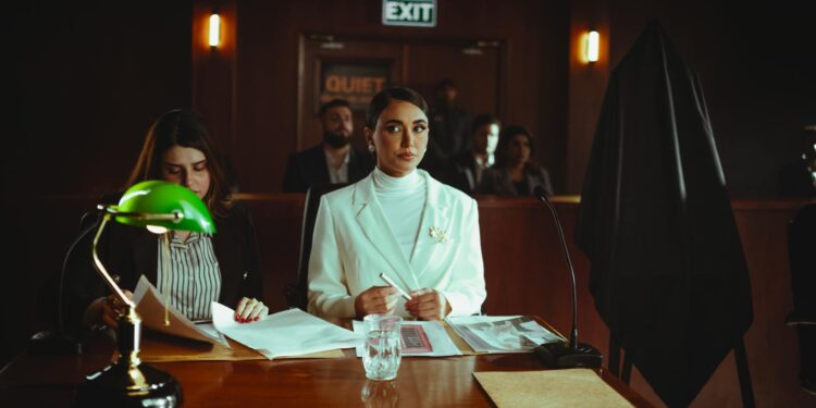 Courtroom scene with a judge, defendant, and lawyers focused on crypto theft case.